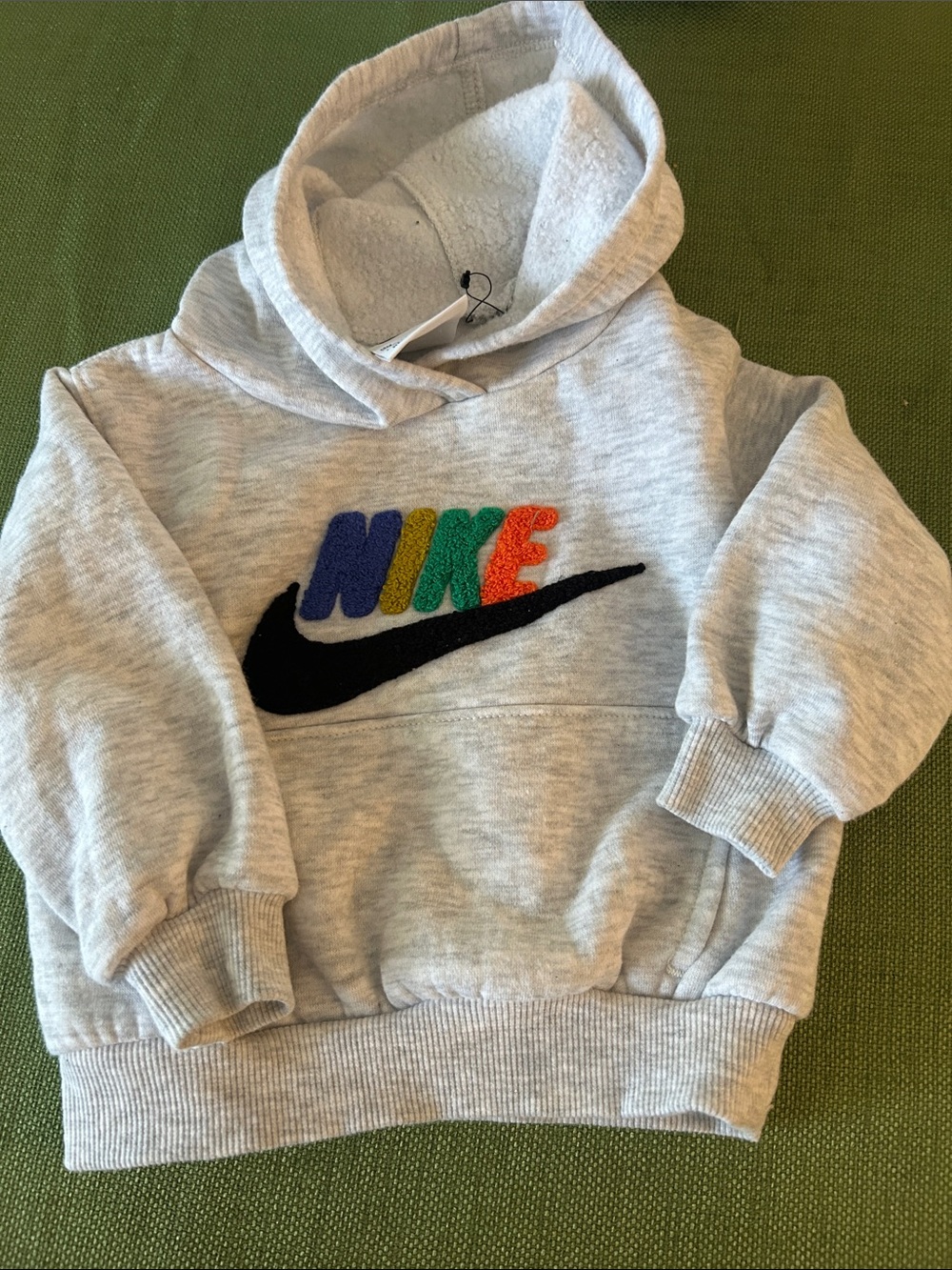 Nike Kids Light Gray Hoodie with Multicolor Logo and Black Swoosh